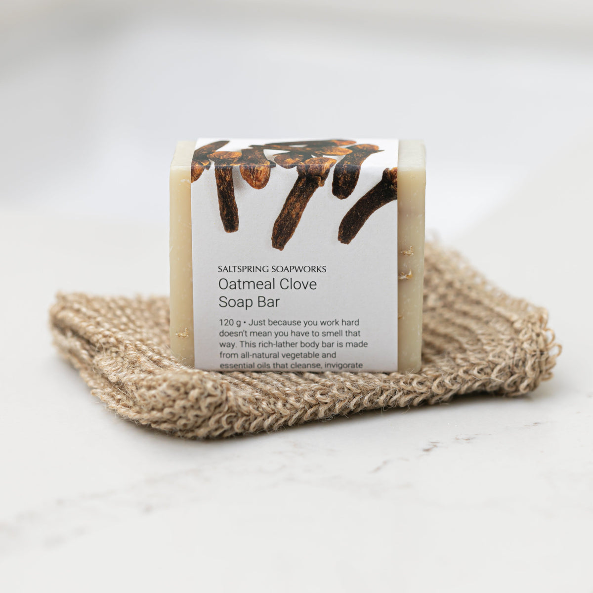 Saltspring Soapworks Oatmeal Clove Soap Bar on natural cloth