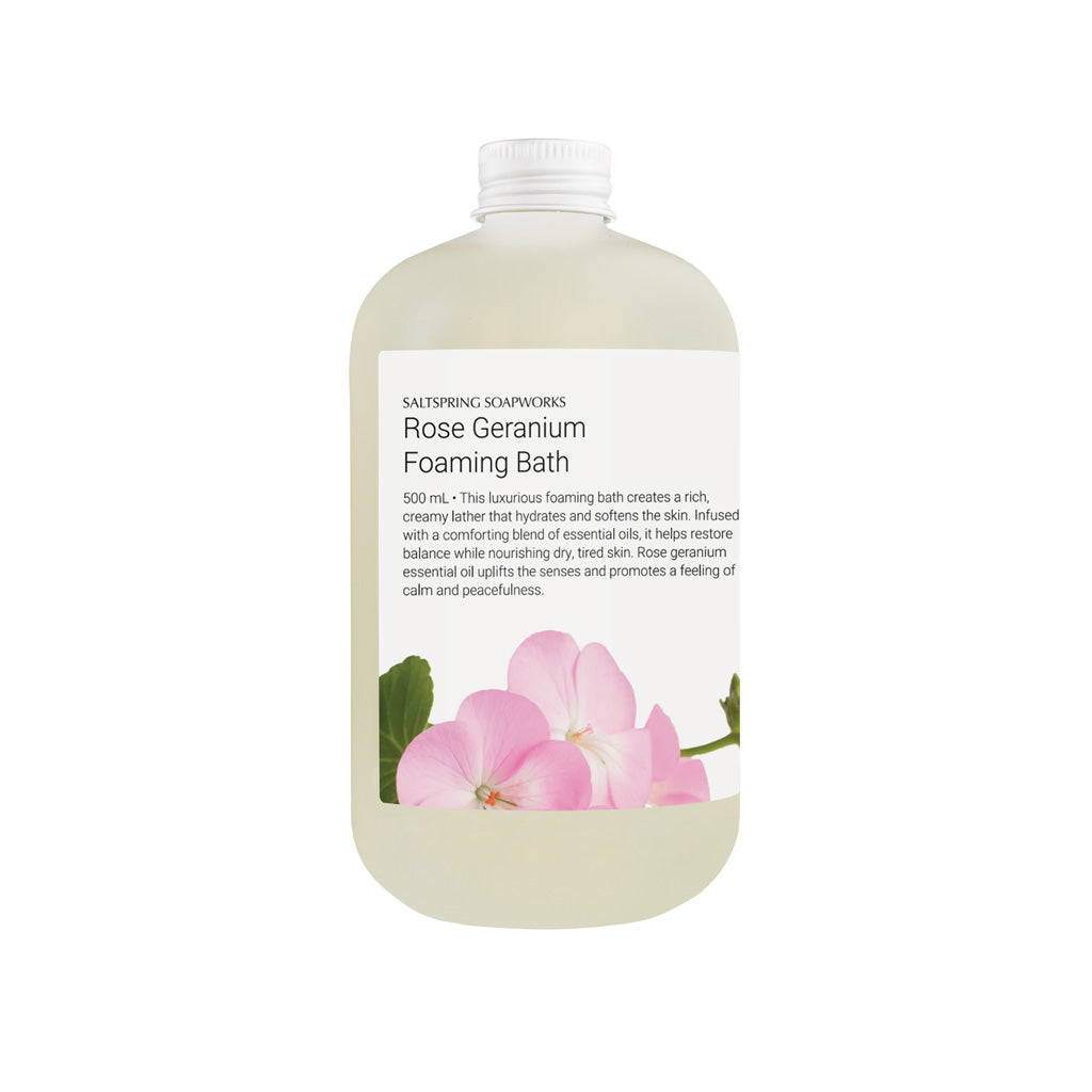 Bottle of Rose Geranium Foaming Bath with floral design on label