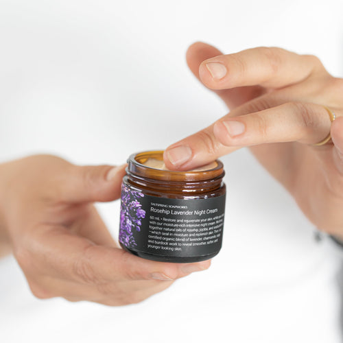 Finger dipping into Rosehip Lavender Night Cream