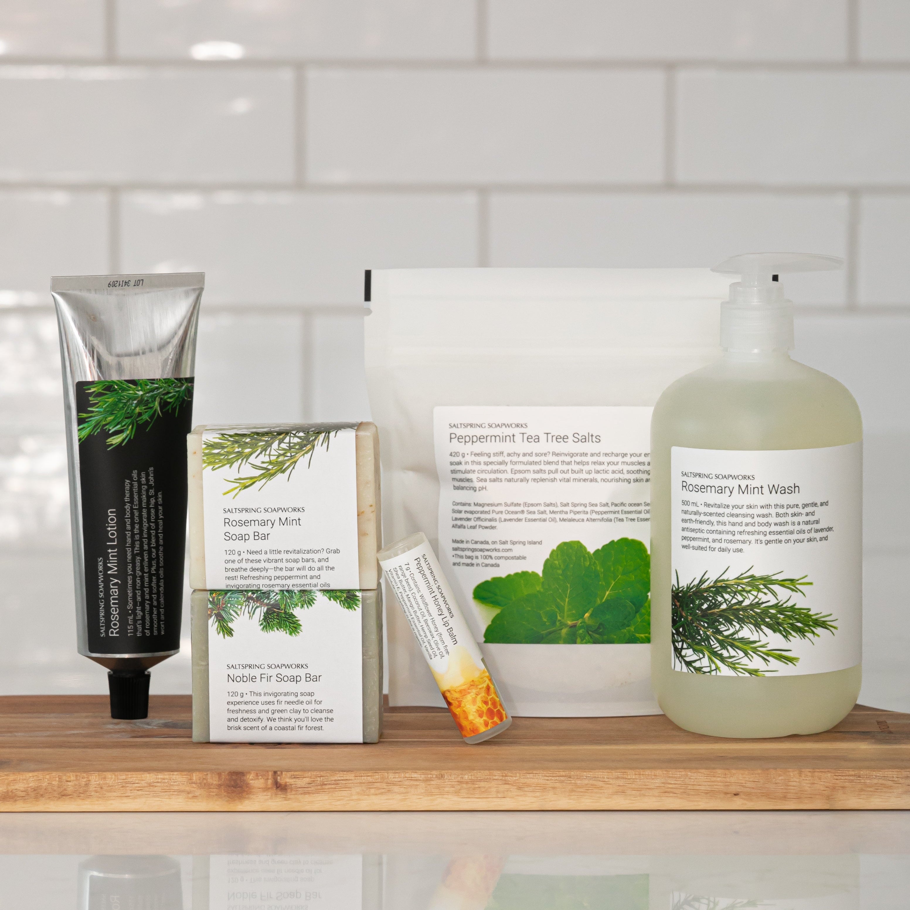 wood shelf with various skincare products like soap bars , lotion, lip balm on a tiled wall background