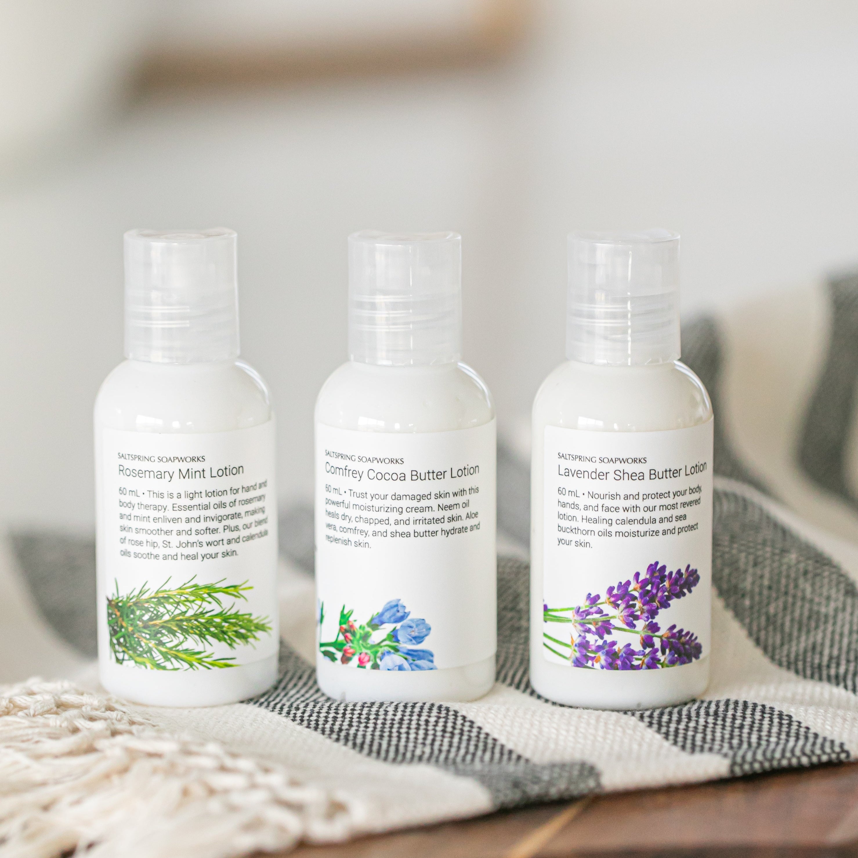 a trio of travel lotion in lavender, comfrey and rosemary mint scents